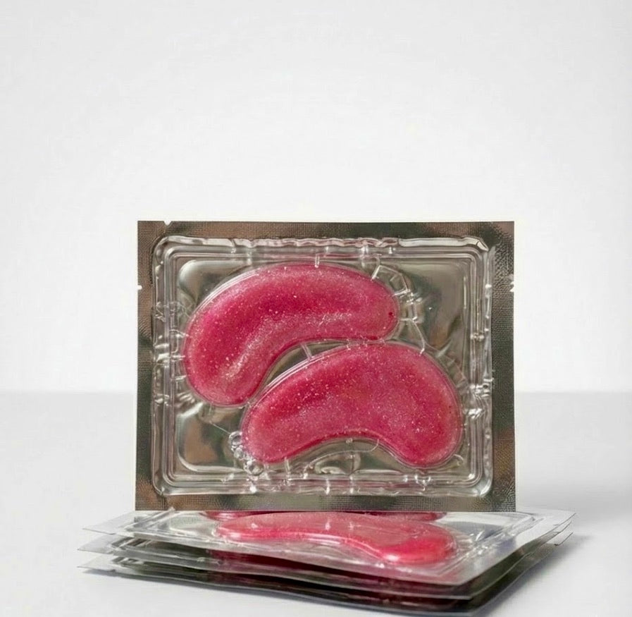 Instant De-Puffing: Our cooling hydrogel technology calms puffiness and refreshes tired eyes in just 15 minutes.

Collagen Boost: Infused with vegan collagen to help firm the delicate under-eye area and smooth the appearance of fine lines.

Deep Hydration: Formulated with Hyaluronic Acid to lock in moisture for a plump, "glass-skin" finish.

Camera-Ready: The gorgeous pink glitter finish makes these the perfect accessory for your skincare selfies and GRWM videos.